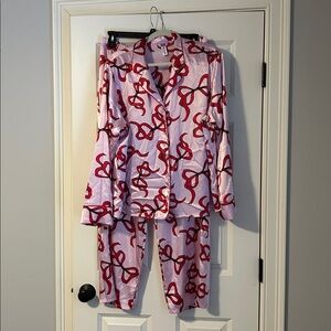 Women’s satin pajamas two piece, long sleeve, xlg. Pink with red bows.